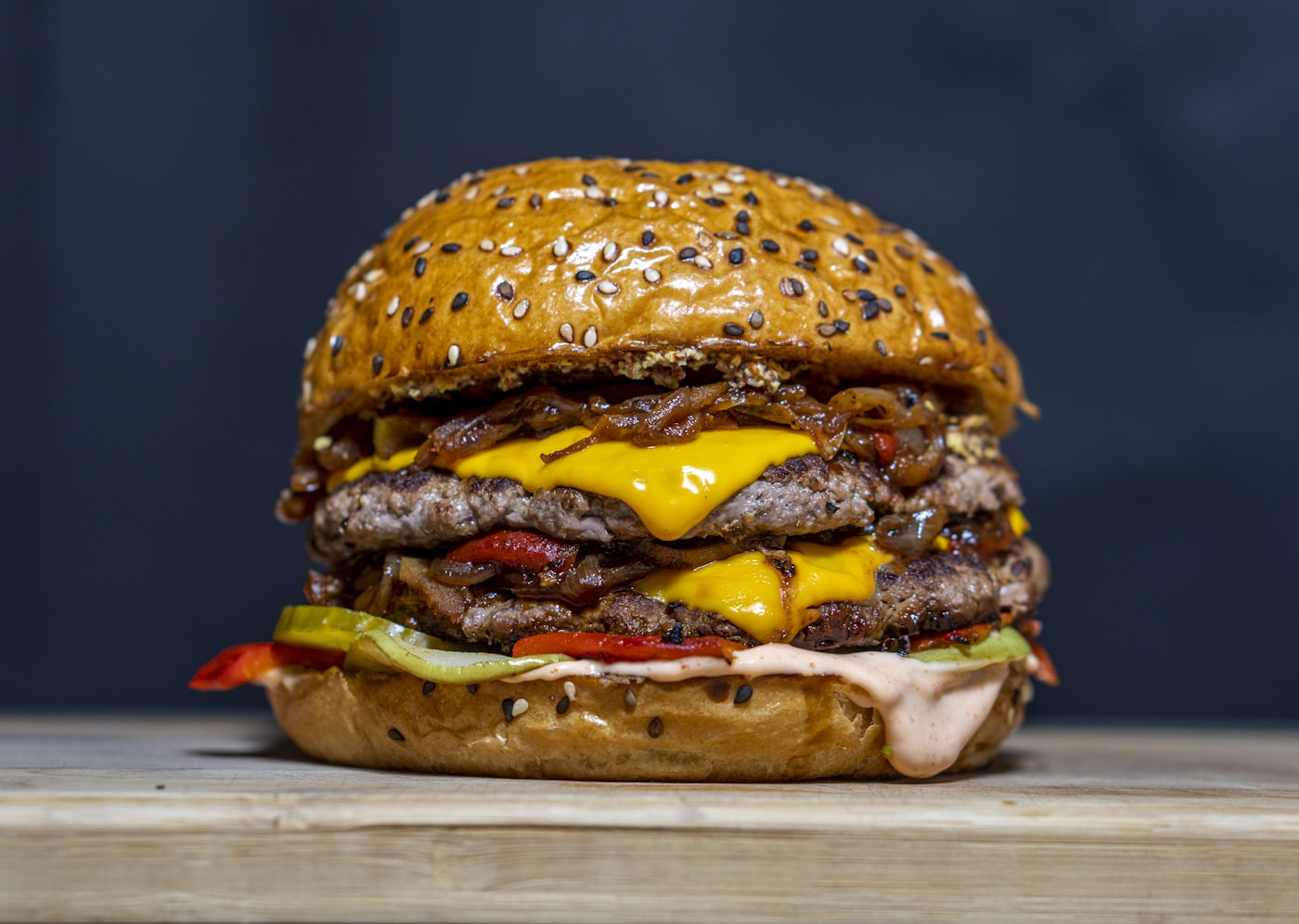 A loaded cheeseburger from a Sharm kitchen, delivered hot to your room